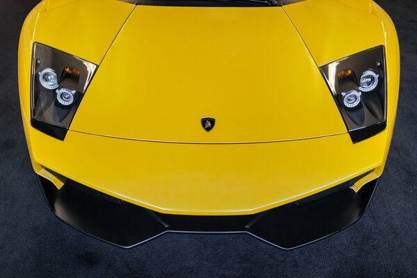 Bright hood of yellow Lamborghini Murcielago, top view