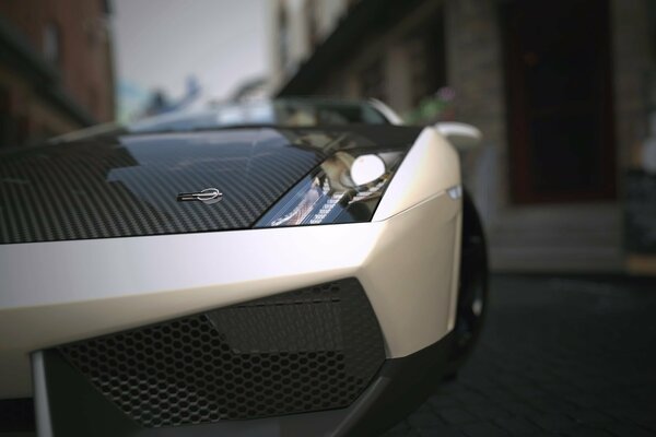 The front of the Lamborghini on a blurry background