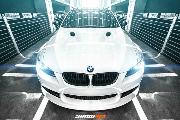 A dazzling white BMW shot from the front