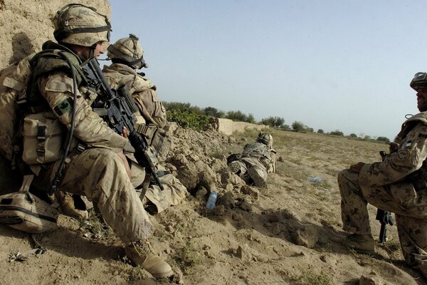 American soldiers with weapons in the field