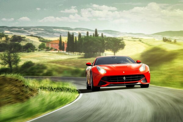 Un Ferrari Berlinetta rojo brillante monta en la carretera