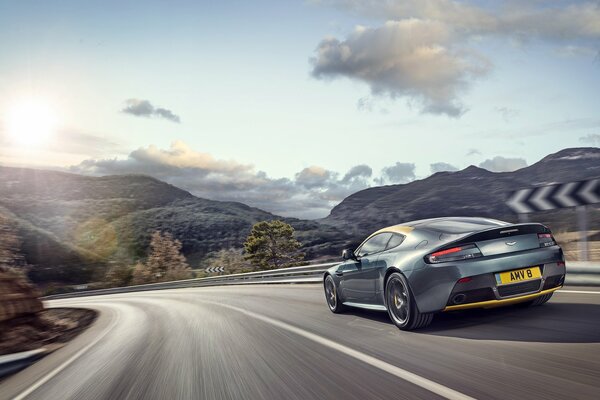 Aston Martin car turns at speed