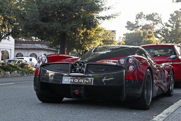 Pagani is in the suburbs on the street. Rear view