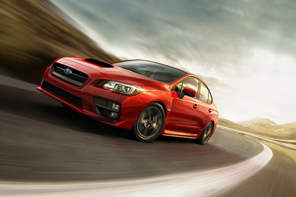 Subaru WRX rosso che guida su strada