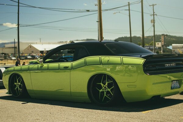 Green Dodge on the streets of the city