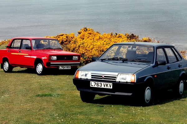 2 Lada cars on the background of the river