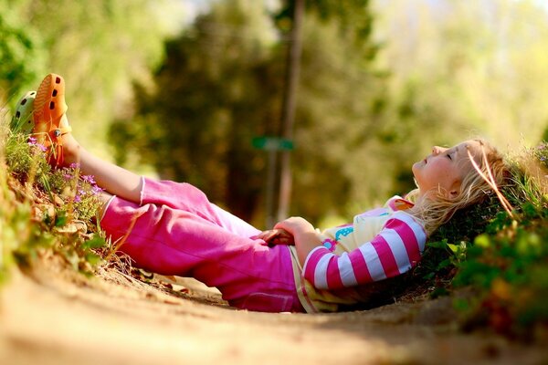 Rest on the forest path the girl is sleeping