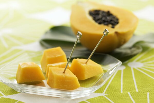 Tropical fruits in small pieces on skewers