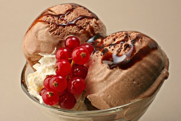 Coffee ice cream with currants in a glass glass