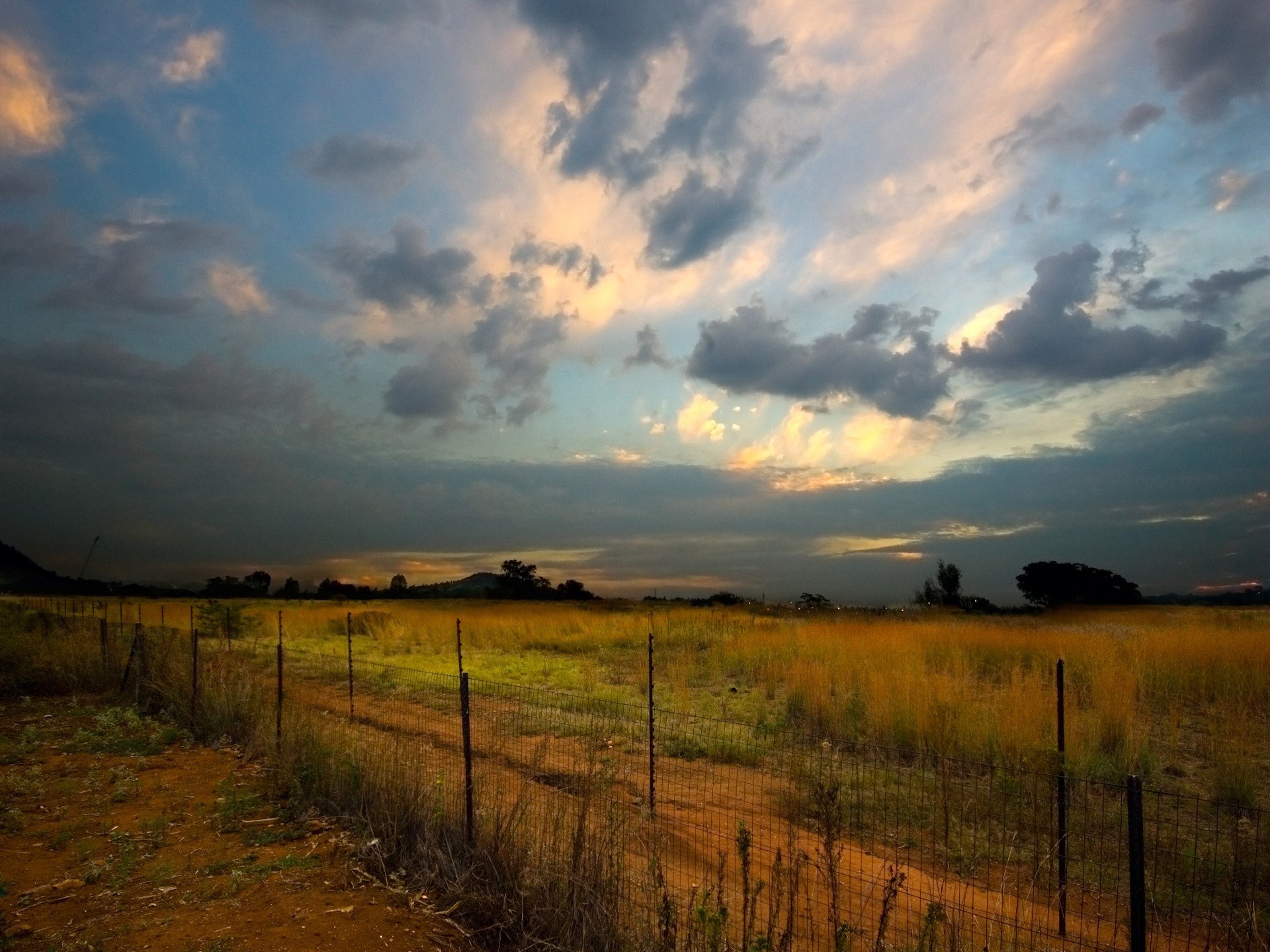 fence wasteland clouds night