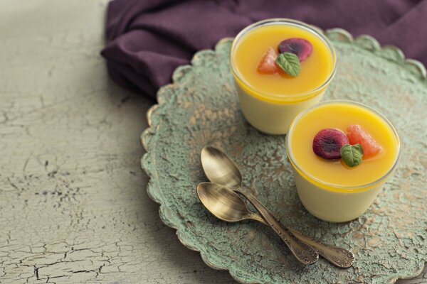 Two desserts with fruit on the table