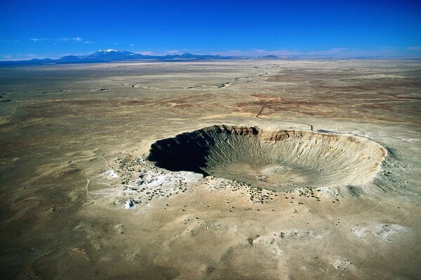Meteor crater in the middle of the desert