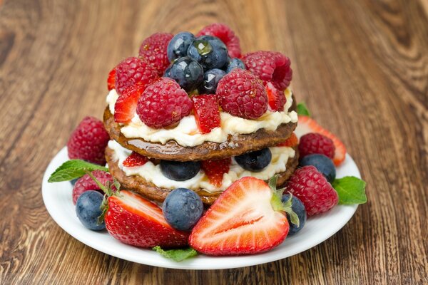 Delicious cake with strawberries, raspberries and blueberries