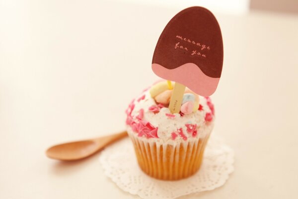 Cupcake with an inscription on a lace napkin