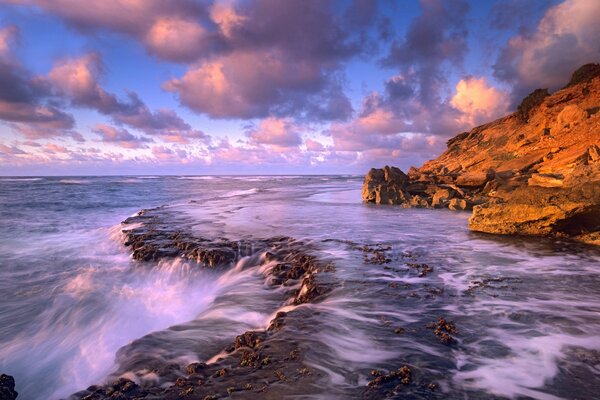 Fantastic seascape with waterfall view