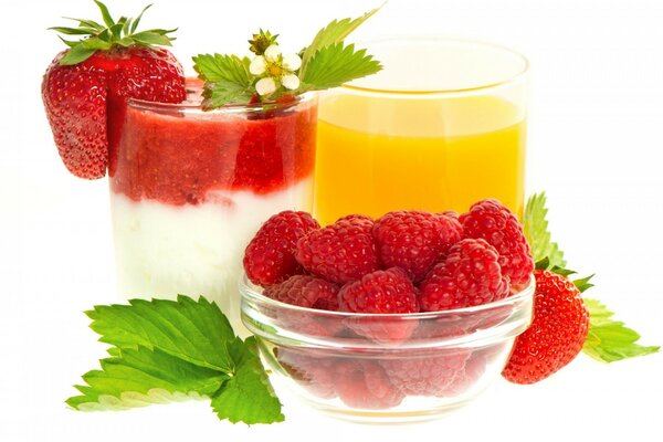 Light dessert with strawberries and raspberries with fresh orange juice