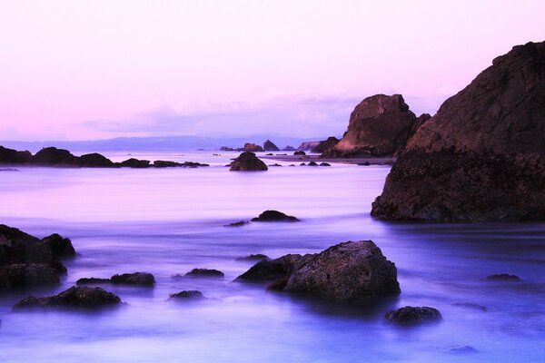 Lilac sunrise in the Bay of stones