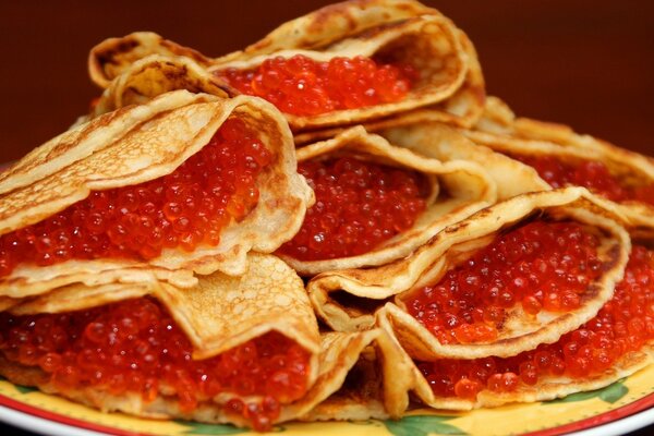 Fresh pancakes with delicious red caviar