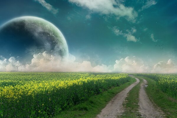 The road in the field to the planet in the clouds