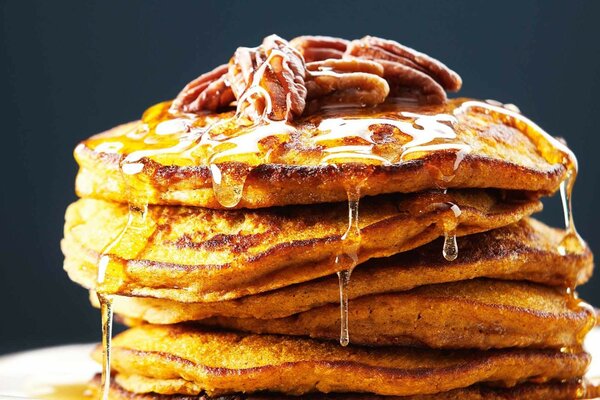 Pancakes with nuts, poured with honey