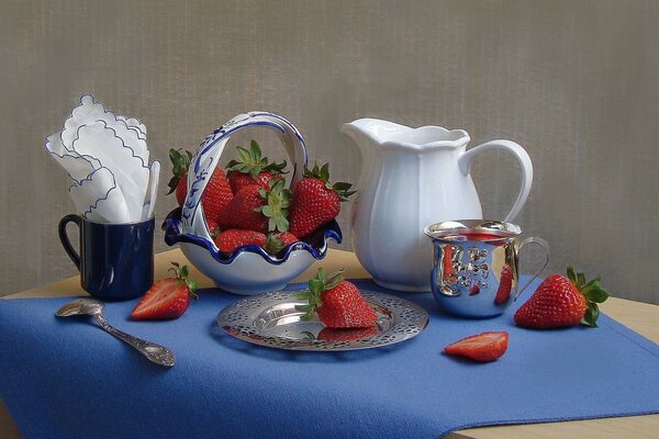 Still life of strawberries and dishes