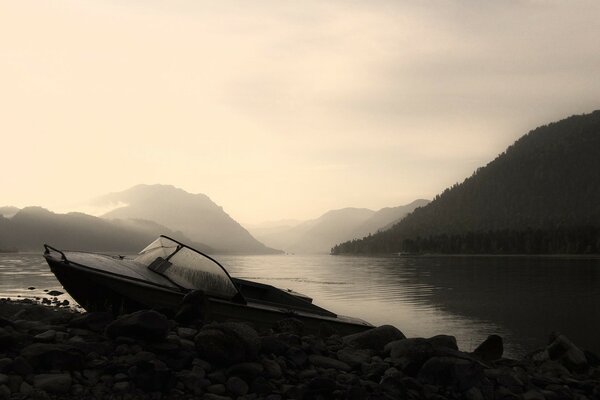 Boat at the shore on a foggy morning