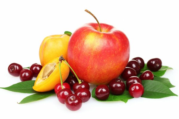 Fruits on a white background, peach slices and cherries