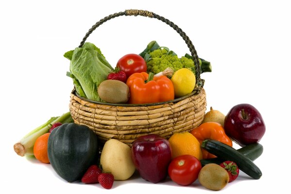 Wicker basket with vegetables on a white background