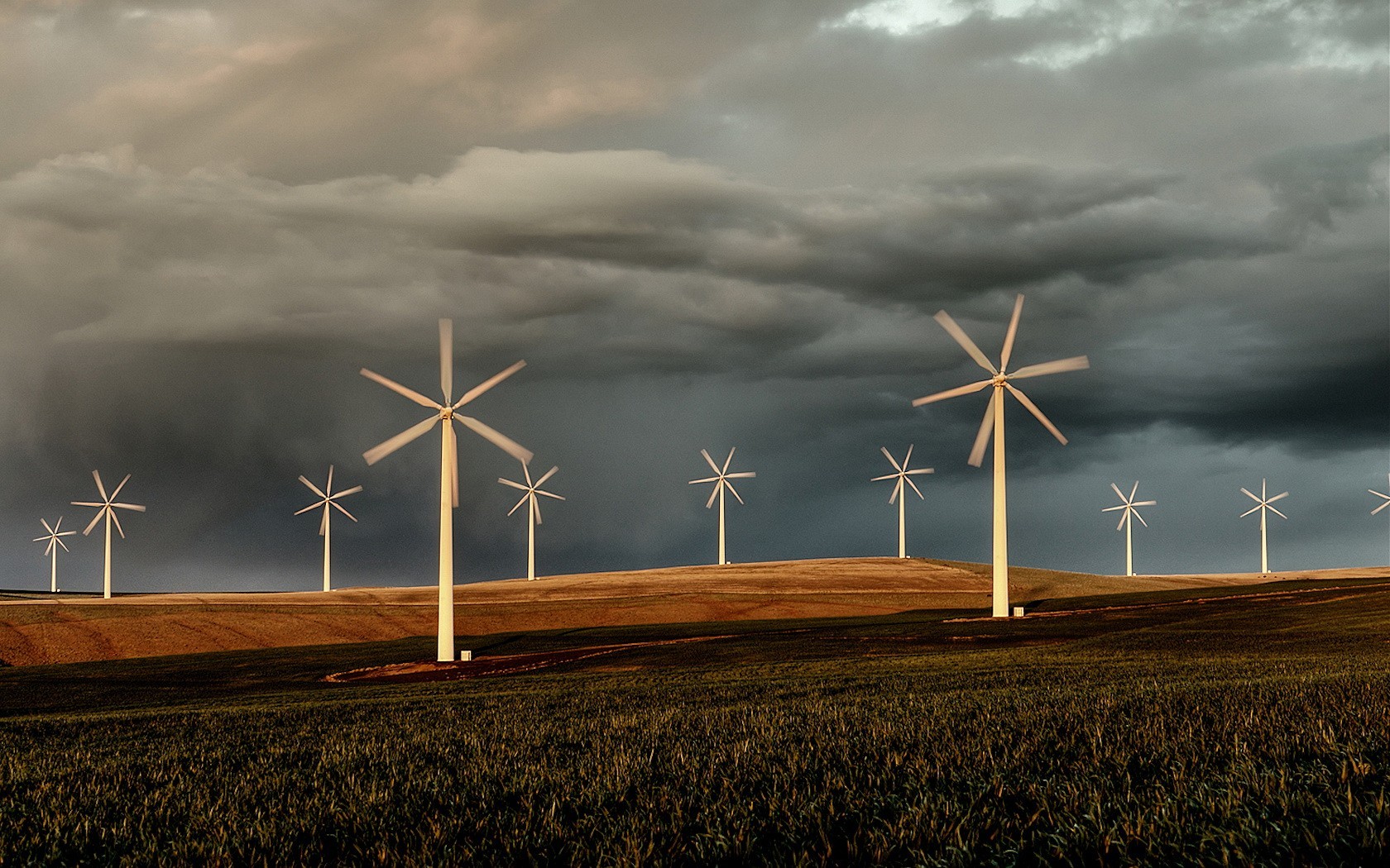 the field clouds wind turbine