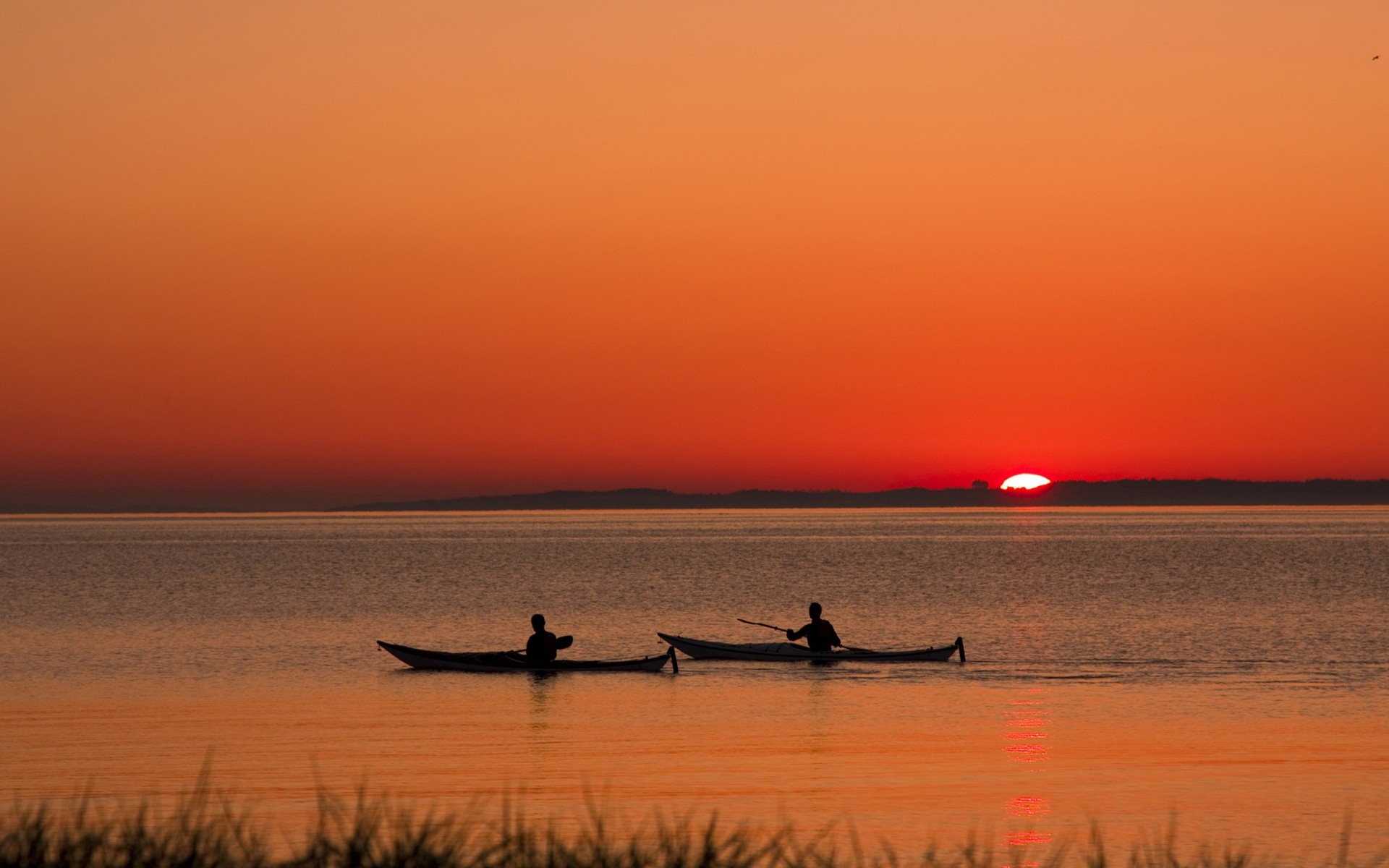zachód słońca jezioro łodzie