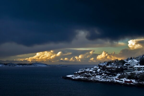 A snow-covered island with houses on it