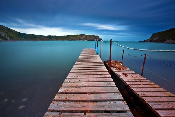 Wooden pier of the blue Bay