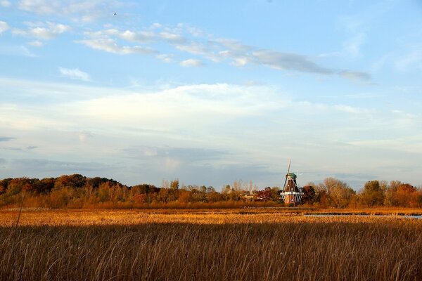 The old mill in the autumn landscape