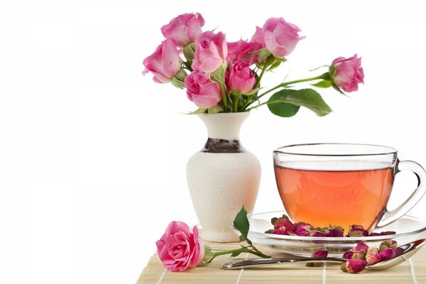 Step cup with a vase of pink roses