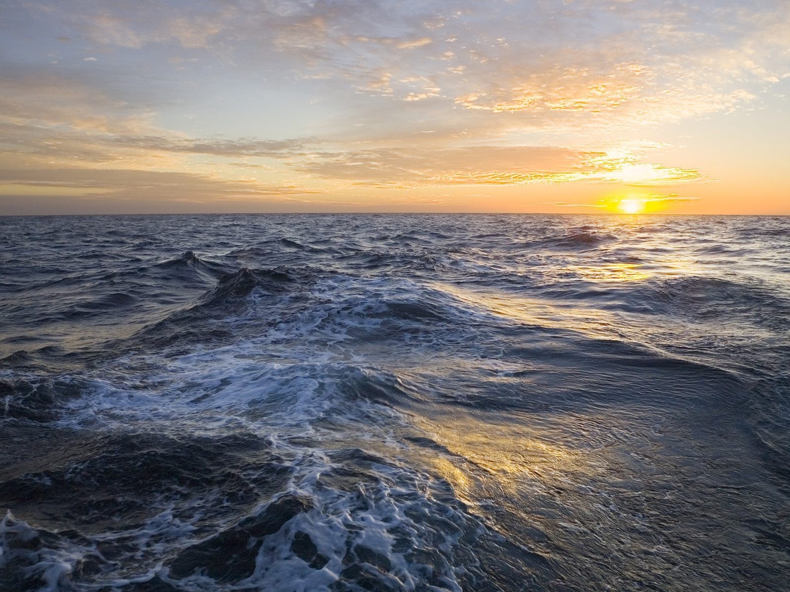 mar olas nubes sol horizonte