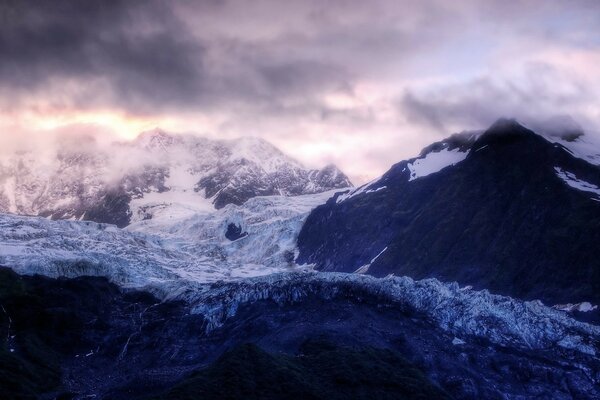 Frozen mountain peaks in the clouds