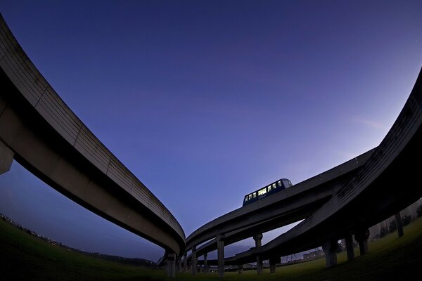 The bus goes on an overpass into the sky