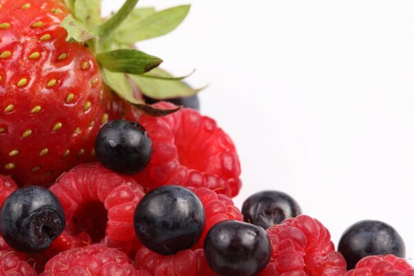 Different berries: strawberries, raspberries, blueberries