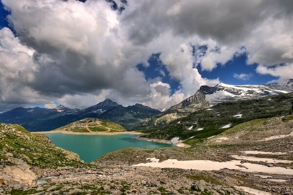 A lake in the mountains with snow-capped peaks