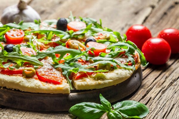 Pizza with arugula. Delicious food