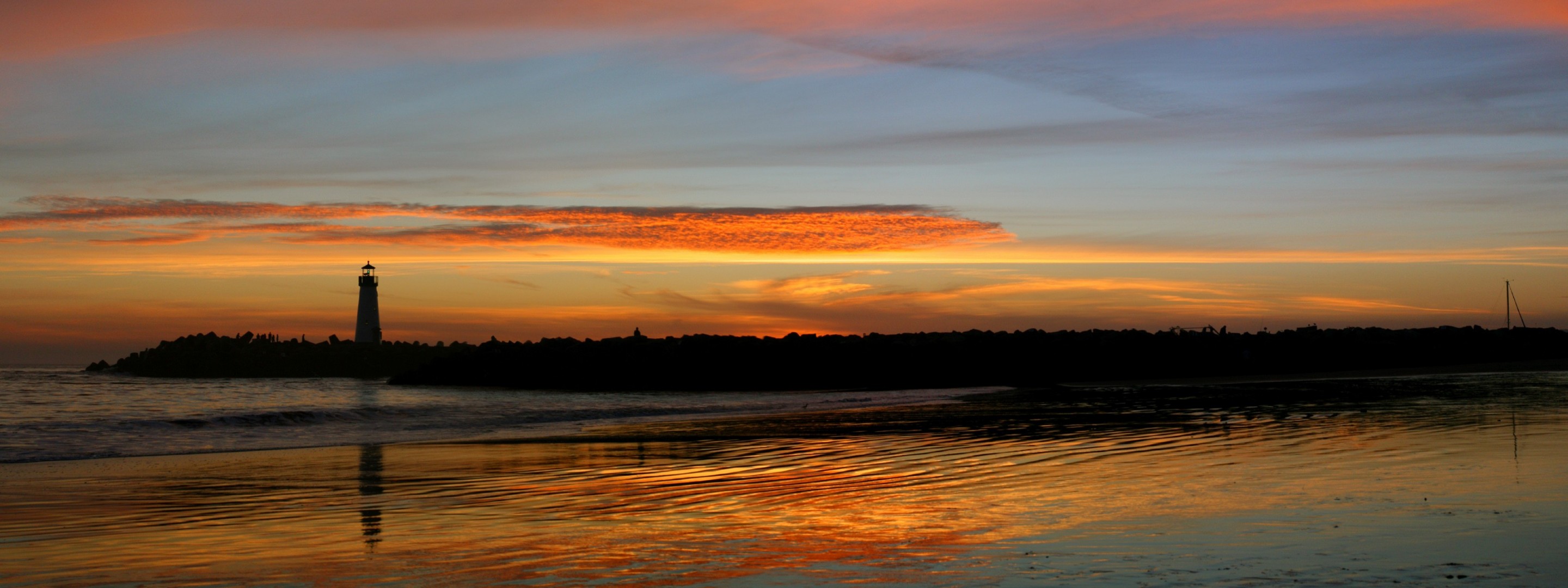 lighthouse sunset wave