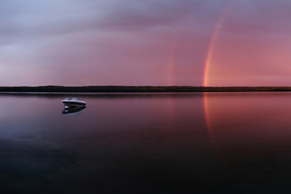 Minimalism photo boat in the lake, rainbow reflection in the water