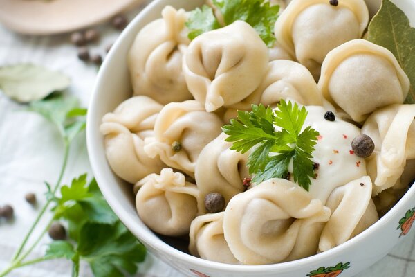 Homemade dumplings decorated with greens