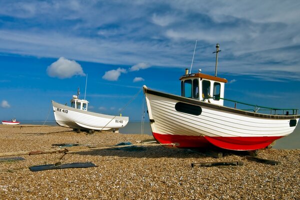 White clouds, pebbles and beautiful boats