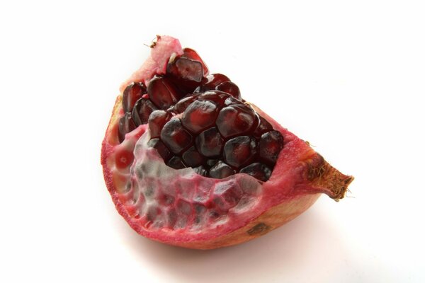 Pomegranate seeds on a white background