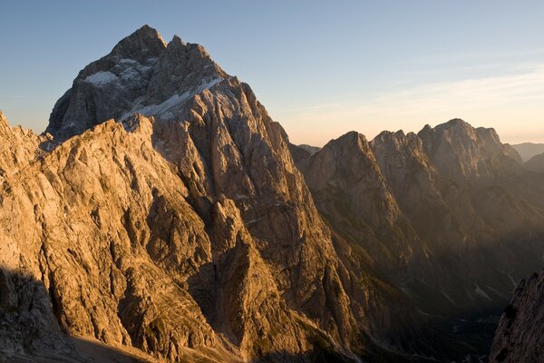 The slope of the mountain in the sunset sky