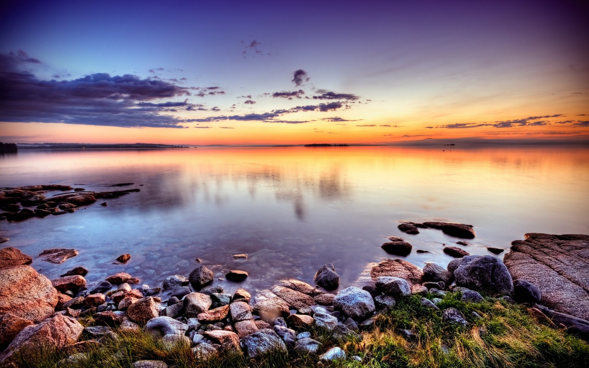 pierres côte coucher de soleil lac nuages