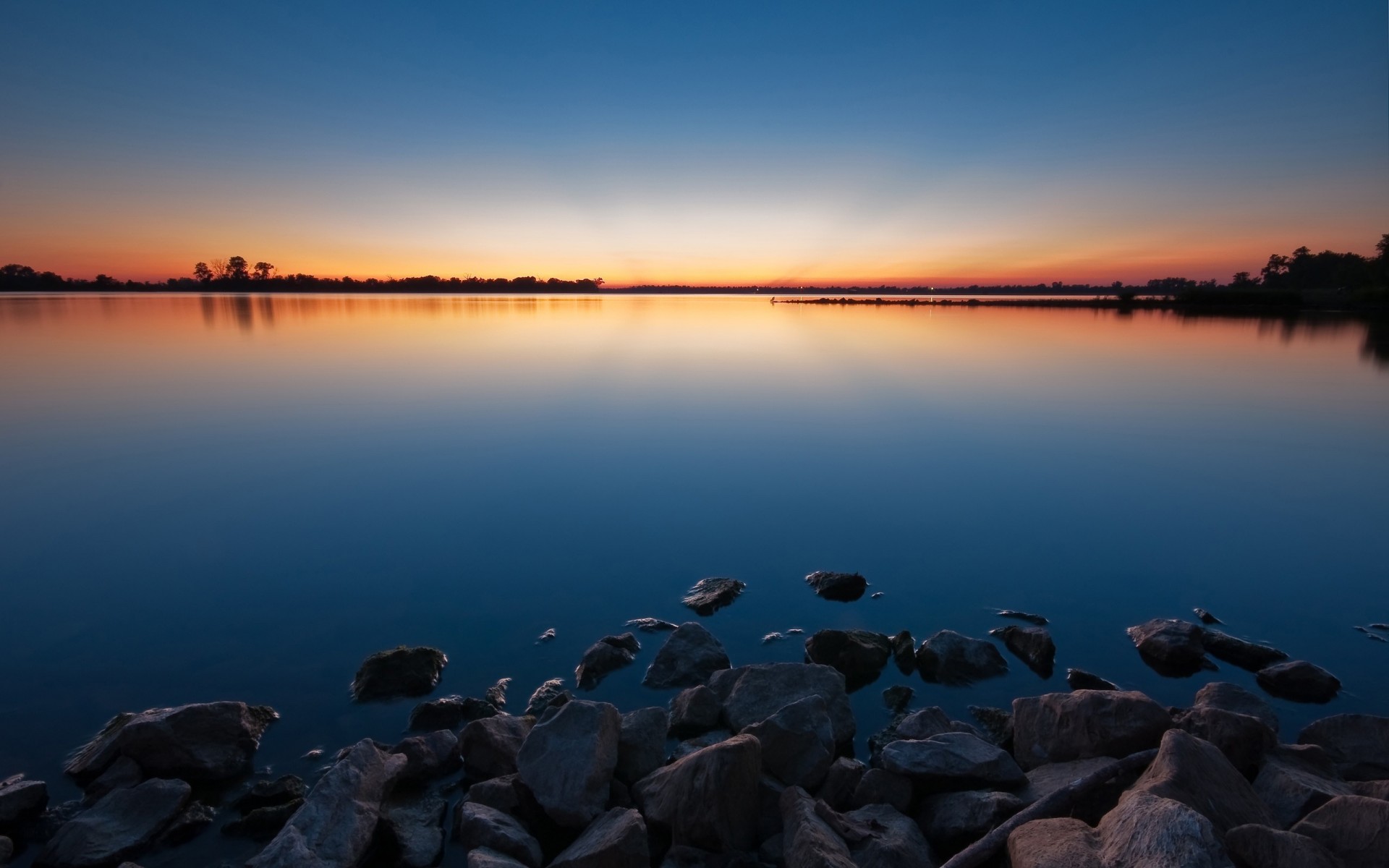 piedras agua lago puesta de sol