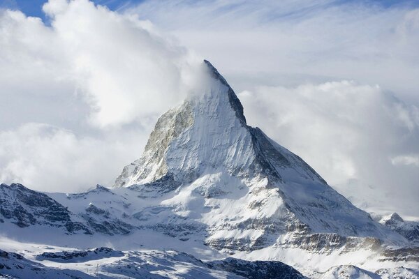 A high snowy mountain in the clouds