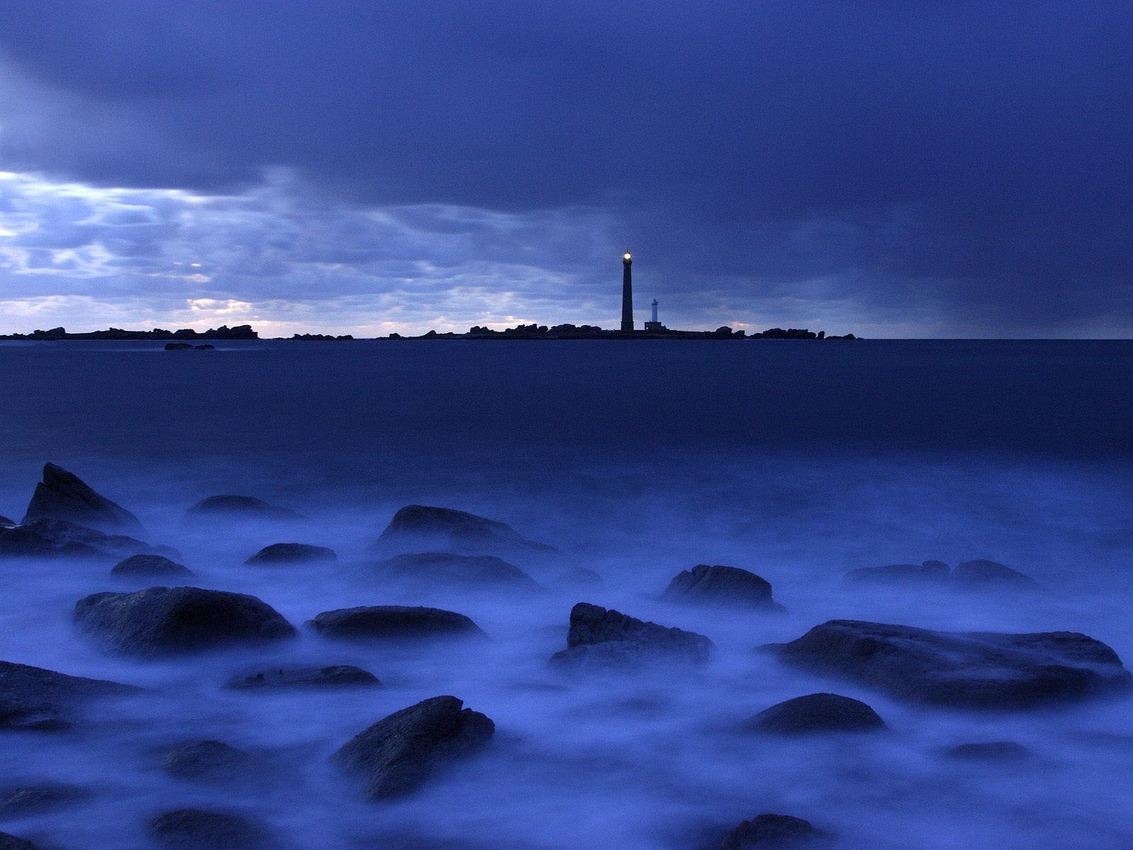 tones lighthouse blue sea